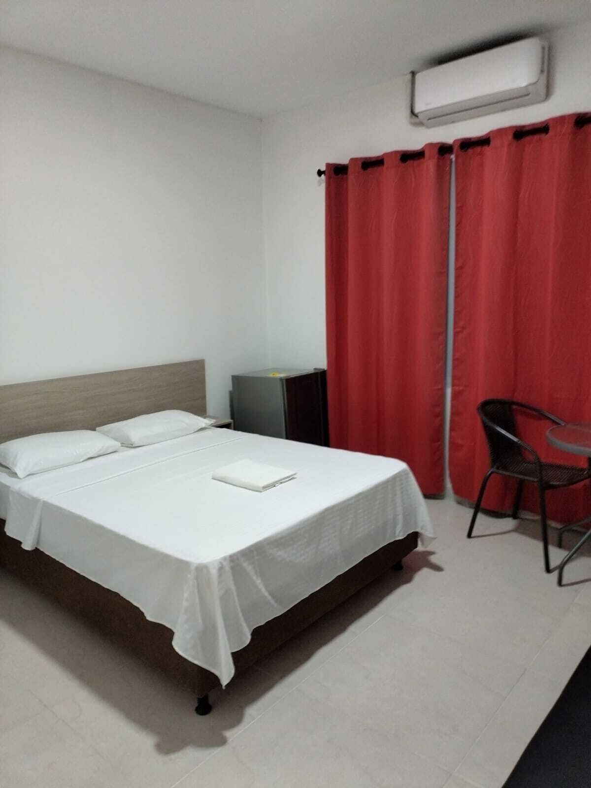 comfort double room, 1 queen bed, garden view, ground floor | premium bedding, minibar, blackout curtains, free wifi