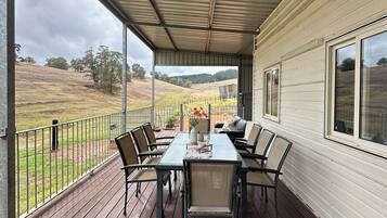 Enjoy dining or socializing on the covered deck with a table and chairs.
