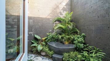 Deluxe Villa, 4 Bedrooms, Bathtub, Pool View | Bathroom | Rainfall showerhead, hair dryer, towels, soap