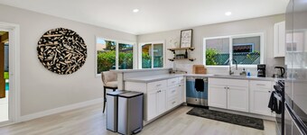 Dog-friendly home with pool, spa, enclosed yard, covered lanai, & fireplace