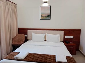 Basic Room | Premium bedding, soundproofing, bed sheets - Royalton Residency (Kanjirappally)
