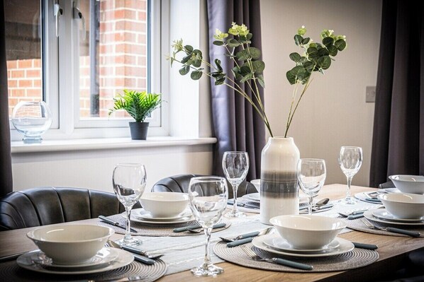 Enjoy a meal in the comfort of your room, with a neatly set table and beautiful views.
