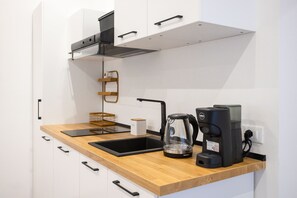 Fridge, microwave, stovetop, coffee/tea maker