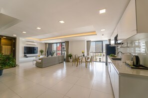 Premium Duplex, 2 Bedrooms | Living area | 55-inch Smart TV with cable channels - Noden Hotel & Apartment (Phnom Penh)