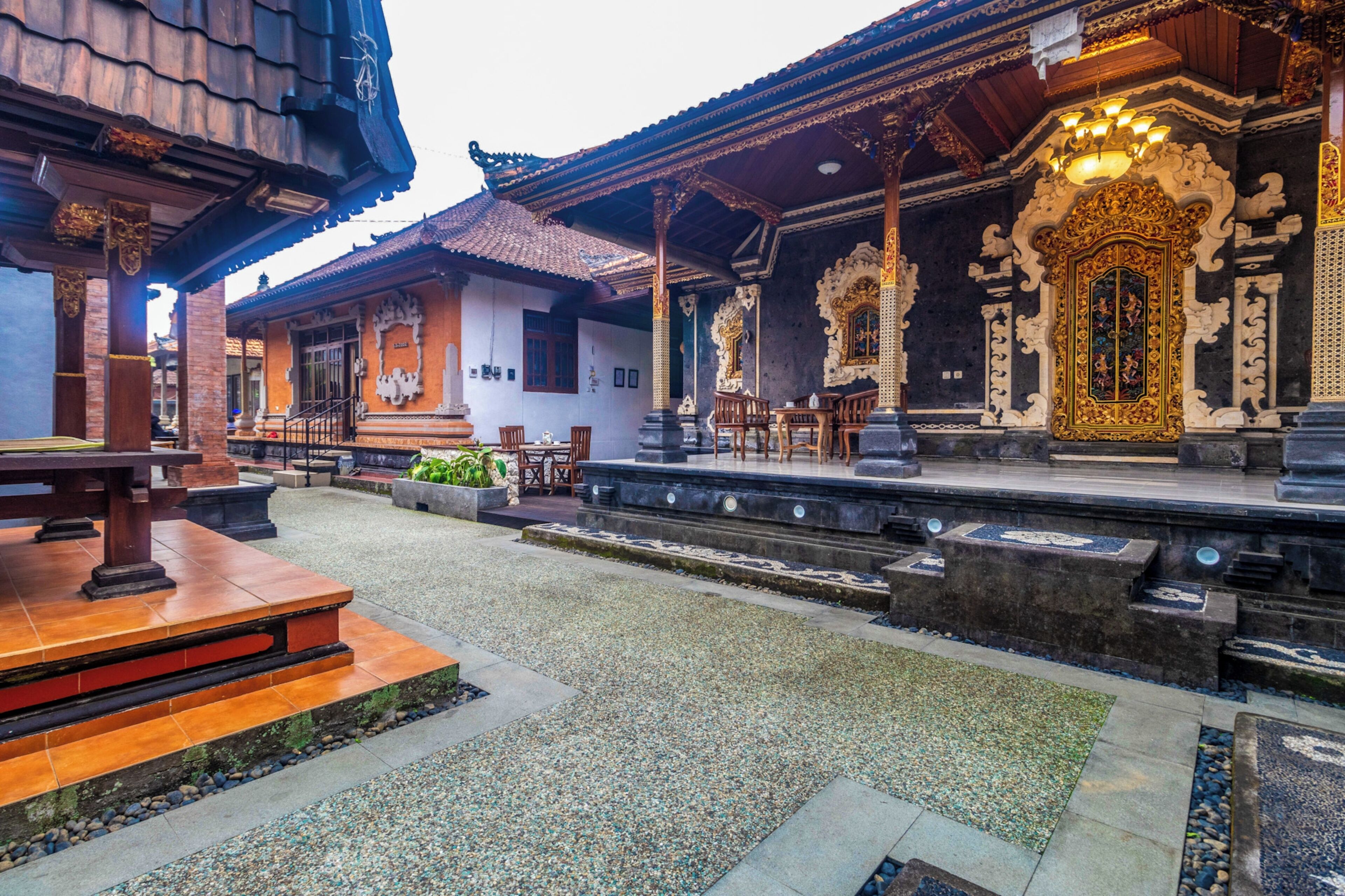 A traditional building with ornate architecture, including detailed carvings and a tiled roof.