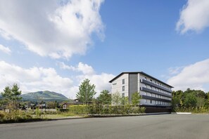 A modern building with a flat roof and a sign that reads 'Fairfield.' - Fairfield By Marriott Kumamoto Aso (Aso)