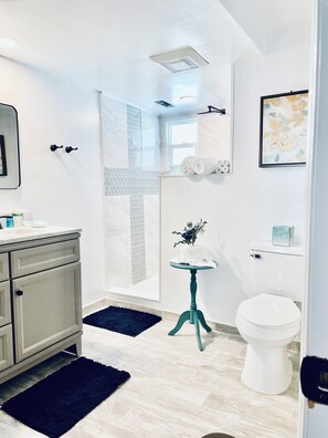 Shower, hair dryer, towels, soap