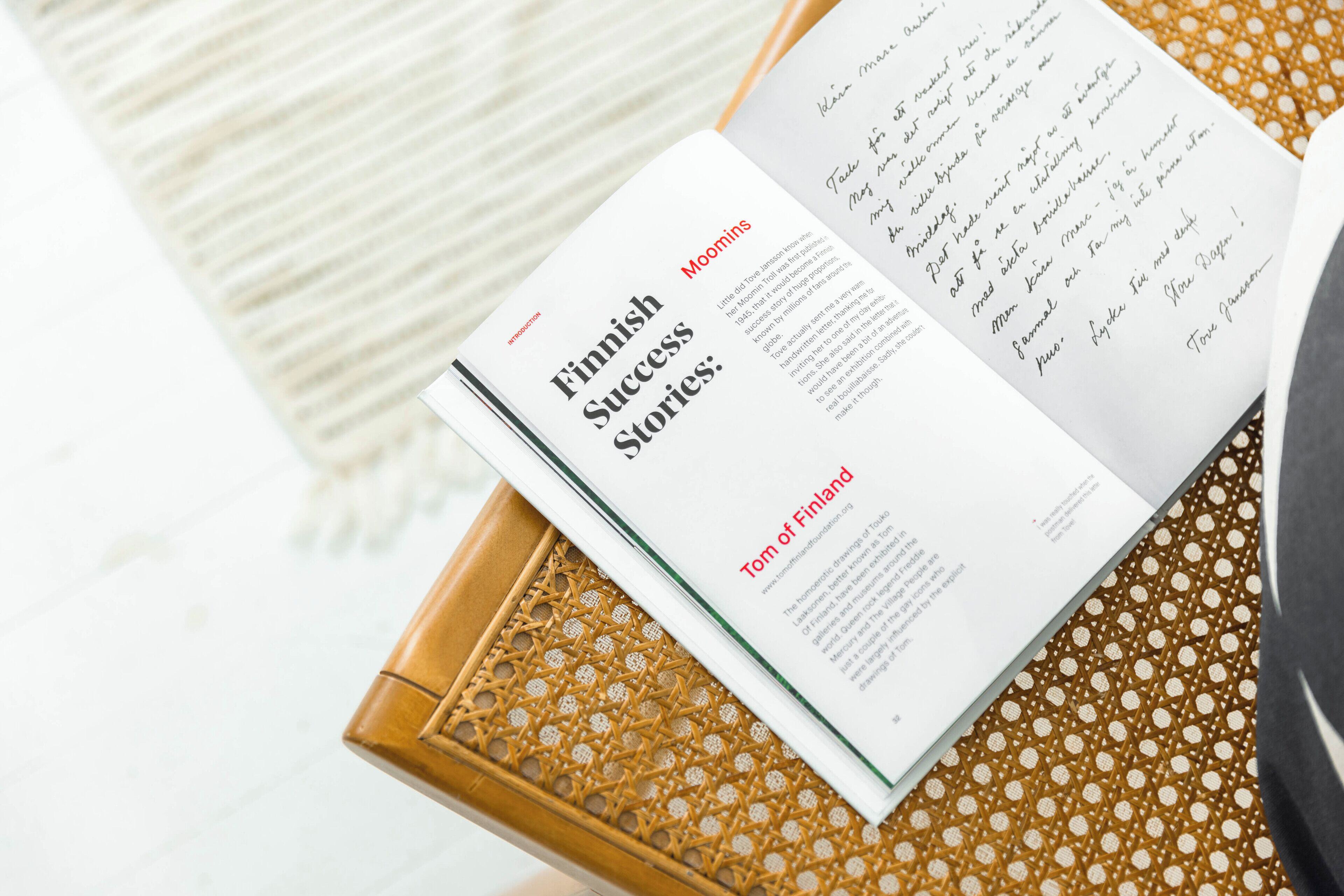 An open book with the title "Finnish Success Stories" on the left page.