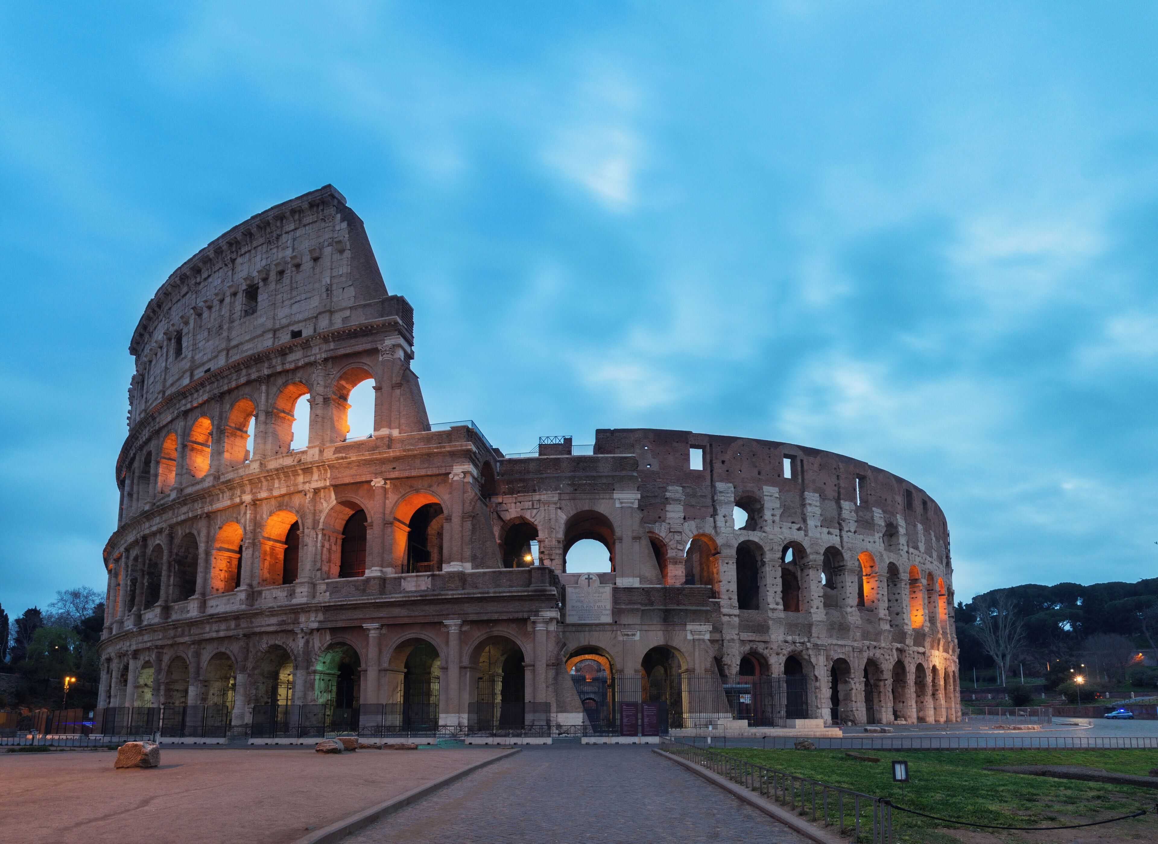 The Colosseum with multiple arches and a partially intact structure.