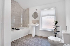 Bathtub, hair dryer, shampoo