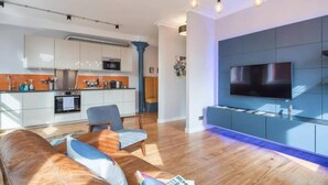 Leilighet, 1 kingsize-seng | Oppholdsområde