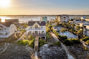A coastal hotel with a pool, a beach access walkway, and a view of the sea. - Marlin View: Oceanfront w/ Pool, Walk to Dining (Garden City)