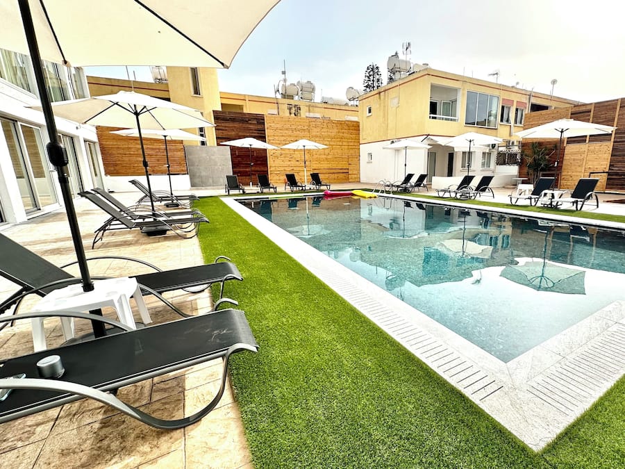 Seasonal outdoor pool, open 8:00 AM to 8:00 PM, pool umbrellas