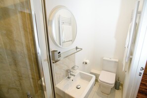 Shower, eco-friendly toiletries, hair dryer, towels