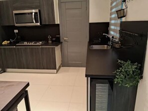 Fridge, microwave, toaster, cookware/dishes/utensils