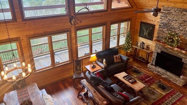 A spacious living room with large windows, a fireplace, and a cozy seating area. - Stunning Views From Lodge, and With hot Tub! (Blue Ridge)