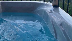 A hot tub with two glasses of red wine and a bottle on a balcony with a mountain view. - Stunning Views From Lodge, and With hot Tub! (Blue Ridge)