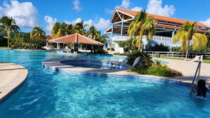 A resort pool with a hot tub, lounge chairs, and a covered pavilion. - Private Ocean Front Via Maris Villa with Big Pool @ Culebra, Recently Refreshed! (Culebra)