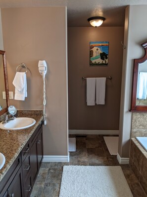 Jetted tub, hair dryer, towels, soap