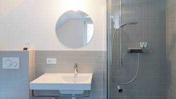 Shower, rainfall showerhead, hair dryer, towels