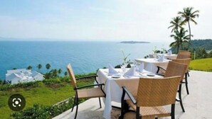 A table set for dining with a view of the ocean. - Wake Up At Paradise (Santa Barbara Samana)