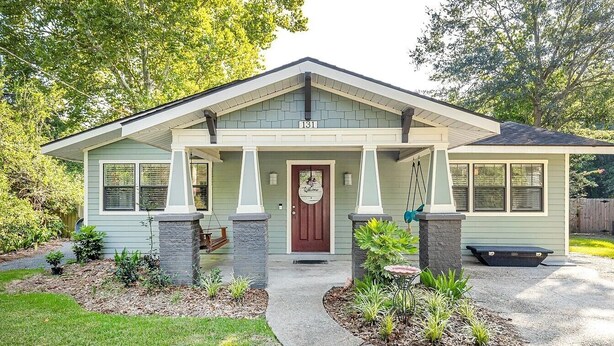A single-story house with a front porch, a mailbox, and a number 131 sign. - Beach Cottage Lafayette Circle (Ocean Springs)