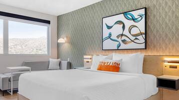 Premium bedding, desk, laptop workspace, blackout curtains