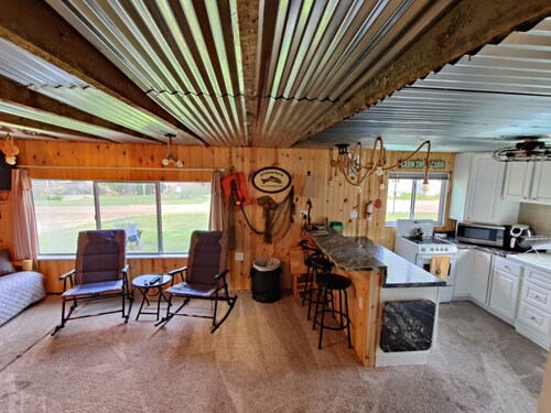 Rustic and charming two-bedroom home a block from the lake and park!