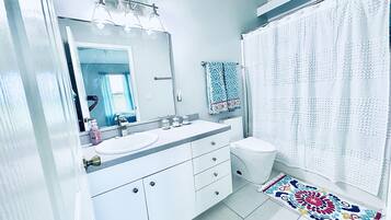 Shower, hair dryer, towels, soap