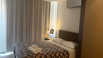 Apartment | 1 bedroom, in-room safe, iron/ironing board, cribs/infant beds