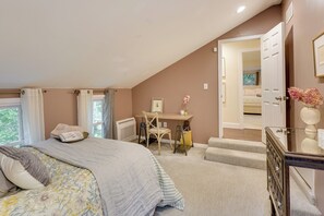 A bedroom with a bed, a desk, and a chair. There is a door leading to another room. - Upper Black Eddy Home w/ Delaware River Access! (Upper Black Eddy)