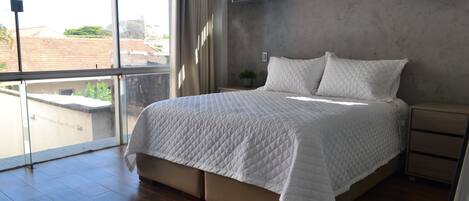 1 bedroom, desk, iron/ironing board, travel crib