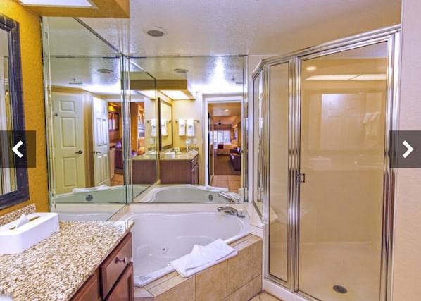 Jetted tub, hair dryer, towels, toilet paper