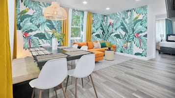 Comfort Apartment | Living area | 50-inch Smart TV with cable channels, streaming services