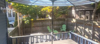 Restoration  - Romantic Getaway with Hot Tub, Deck, Fully Fenced-In Backyard, Bonfire Ring, Grill, A/C, and Great Location!  Also dog-friendly!