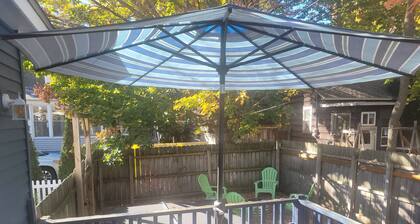 Restoration - Romantic Getaway with Hot Tub, Deck, Fully Fenced-In Backyard, Bonfire Ring, Grill, A/C, and Great Location! Also dog-friendly!