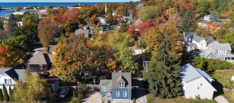 Restoration - Romantic Getaway with Hot Tub, Deck, Fully Fenced-In Backyard, Bonfire Ring, Grill, A/C, and Great Location! Also dog-friendly!