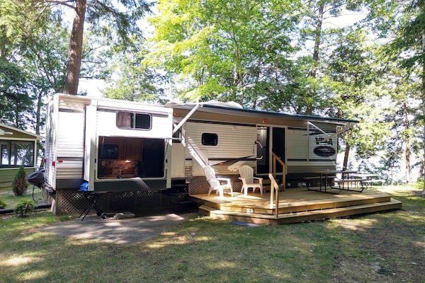 OVERALL: The front of the park home in summer.