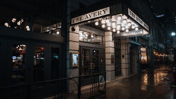 A theater with a marquee reading "The Avery Hotel." - The Avery Hotel (Boise)