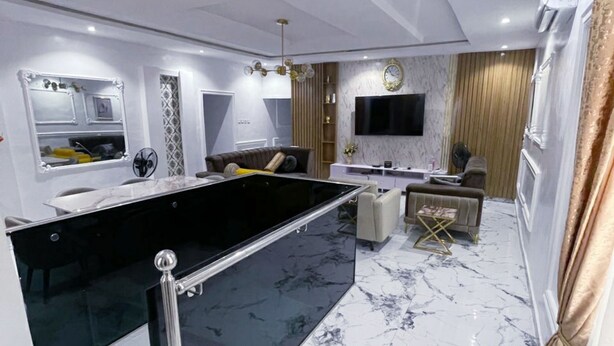 A modern living room with a pool table, a sofa, and a TV. - Spacious 3 bedroom  Apartment,  All room ensuite , Ipaja Lagos (Lagos)