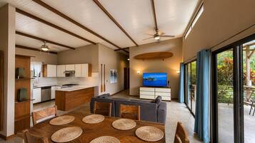 A modern interior with a dining area, kitchen, and living space.