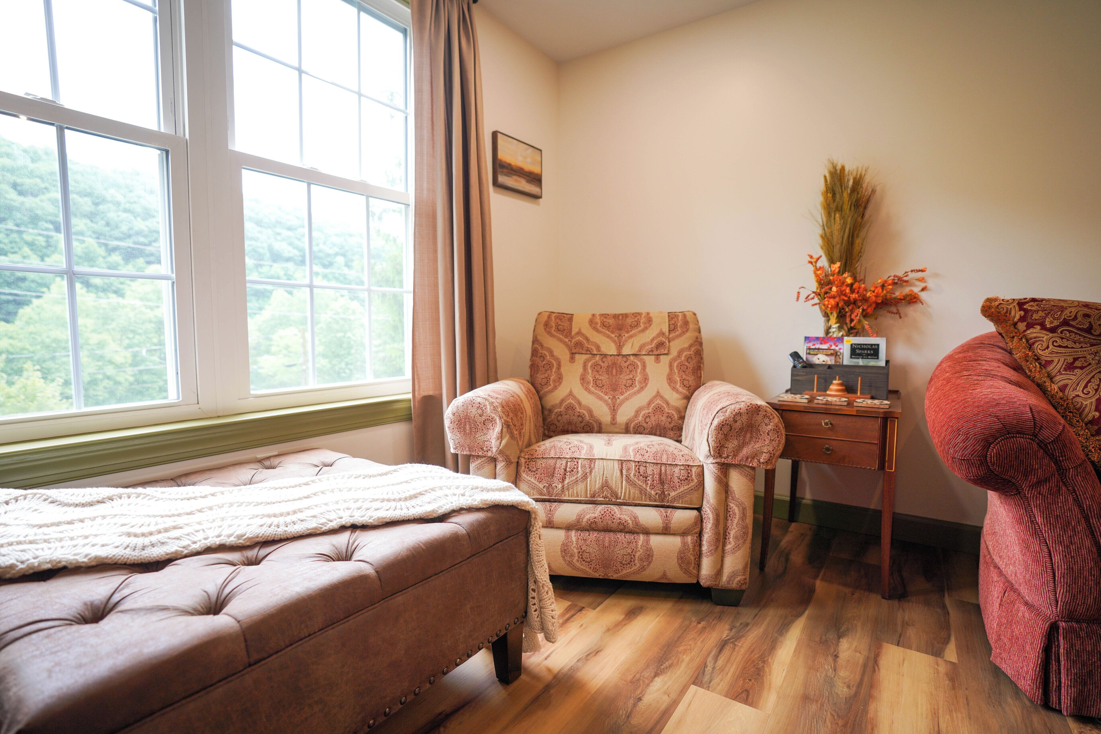 Deluxe Penthouse | Living area | 55-inch Smart TV with digital channels, books