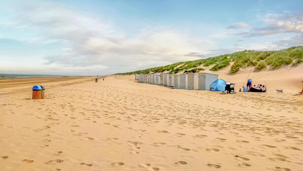 A beach with portable toilets and a tent set up for camping. - Nice home in Bredene with heated swimming pool (Bredene)