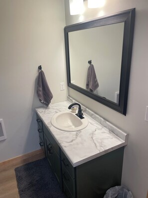 Shower, towels, soap, toilet paper