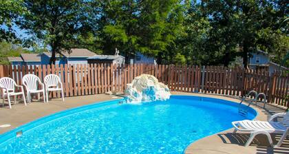 Dog-friendly retreat with pool, hot tub, central AC, firepit, & gas grill