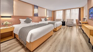 A modern hotel room with two beds, a desk, and a chair. - YISHANG HOTEL (Guangzhou)