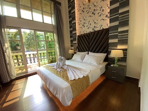 Deluxe Quadruple Room | Premium bedding, desk, bed sheets - DAN Resorts & Weddings (Dahanu)