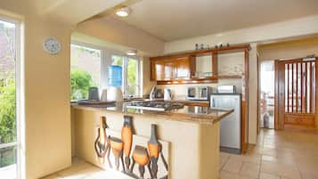 Villa | Private kitchen | Mini-fridge, oven, cookware/dishes/utensils