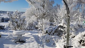 A snow-covered outdoor area with a metal table and benches, surrounded by trees and a clear sky. - The Stables w/Hot tub, amazing views, English Bicknor Forest of Dean (Coleford)