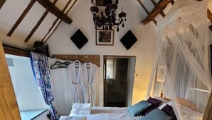 A bedroom with a wooden bed, white linens, a canopy bed, and a chandelier. - The Stables w/Hot tub, amazing views, English Bicknor Forest of Dean (Coleford)